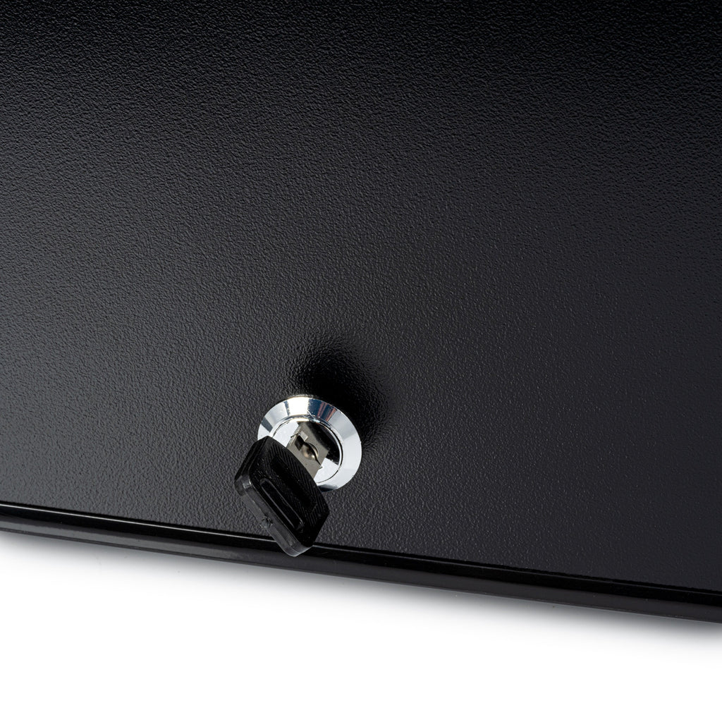 Black mini fridge close-up of door lock knob with chrome ring