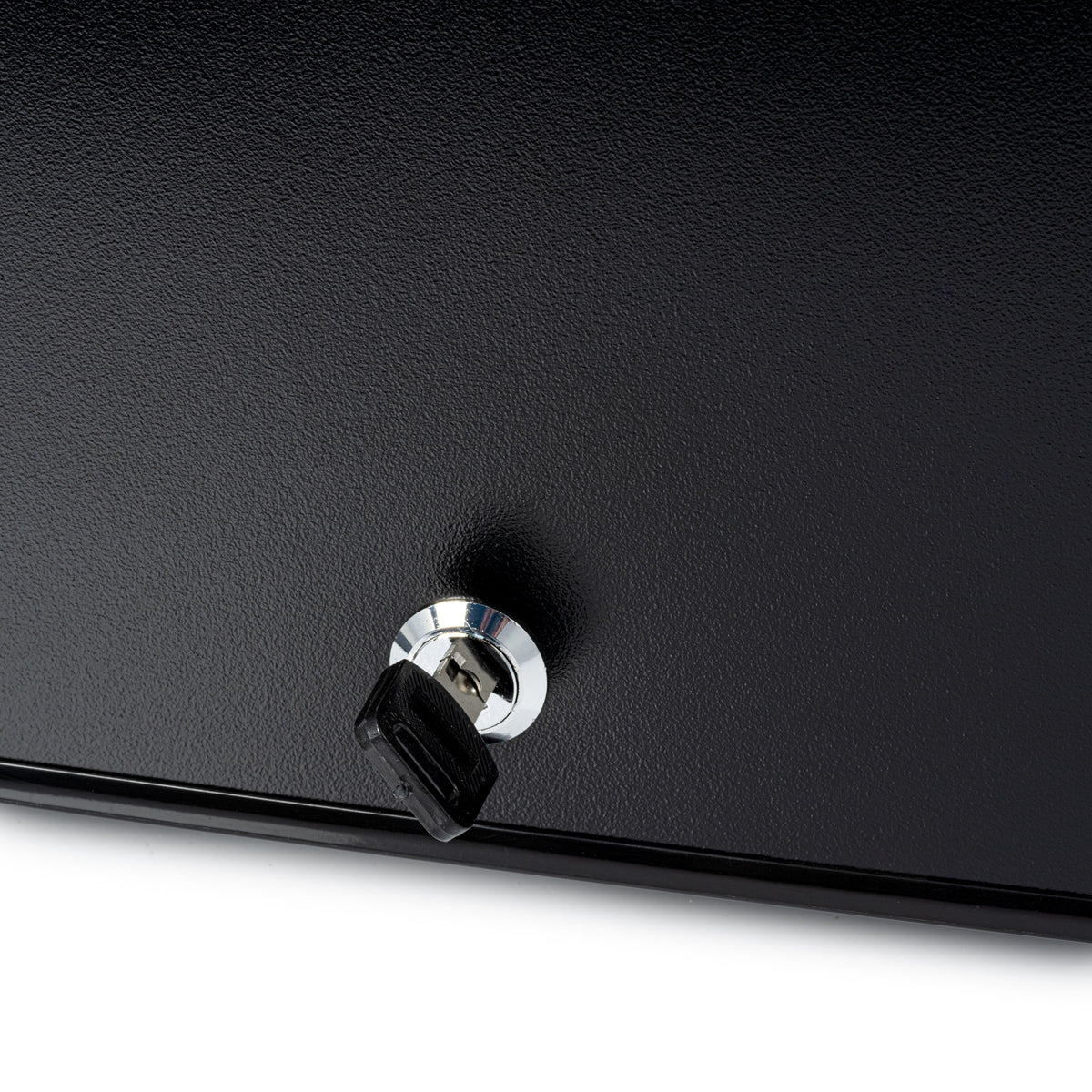 Black mini fridge close-up of door lock knob with chrome ring