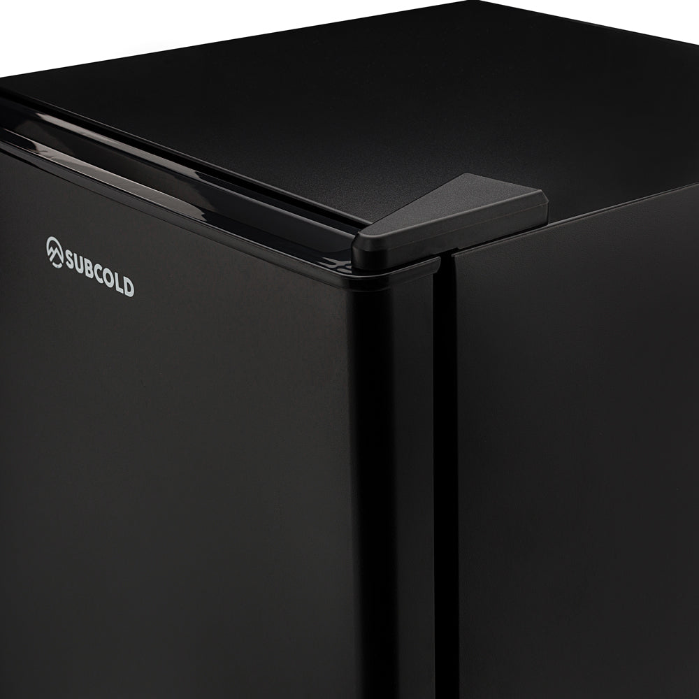 Black mini fridge top panel with recessed handle and Subcold logo
