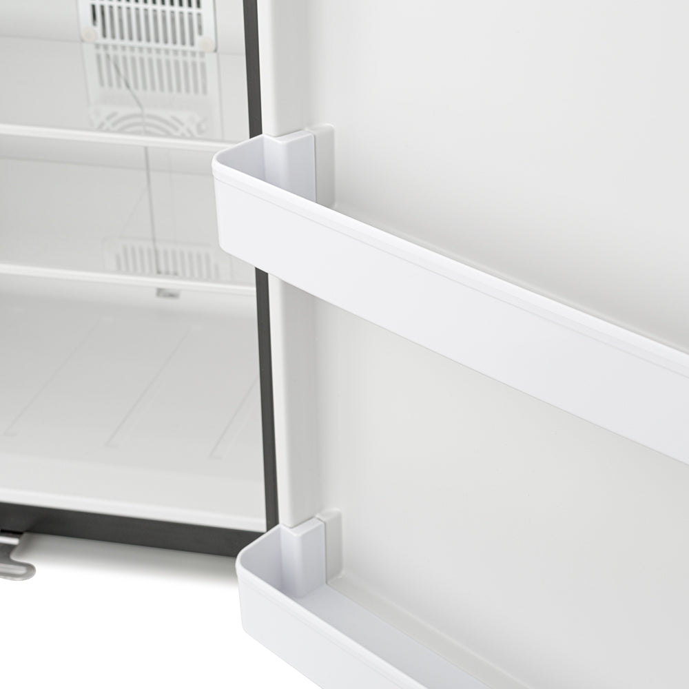 Mini fridge interior with white door shelf and adjustable rail supports