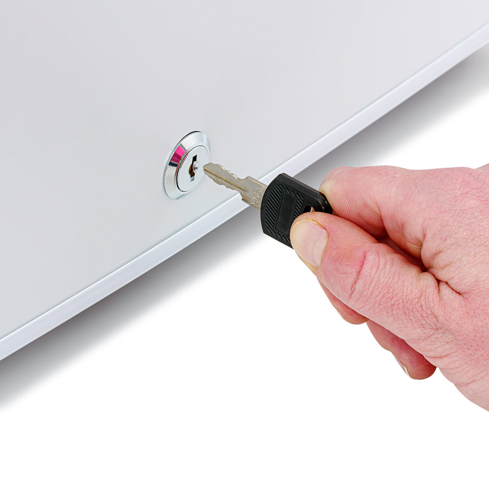 White mini fridge door lock with key held in hand