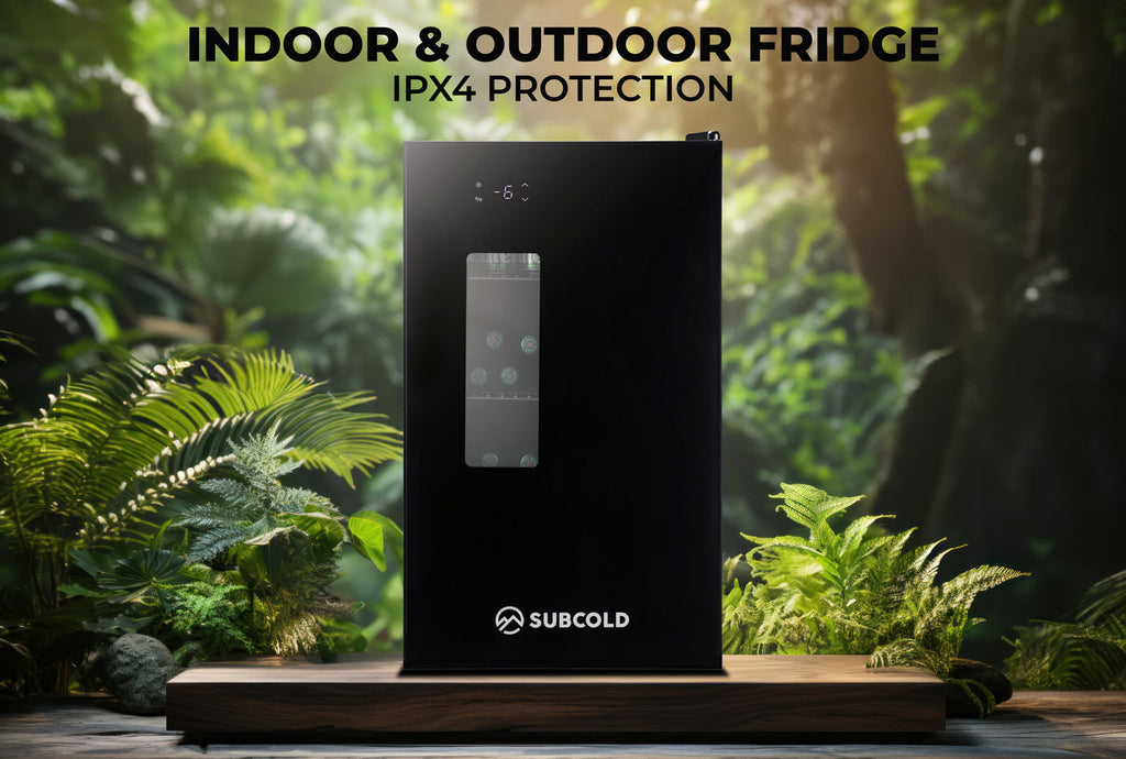 Black beer fridge standing outdoors with glass panel and control display