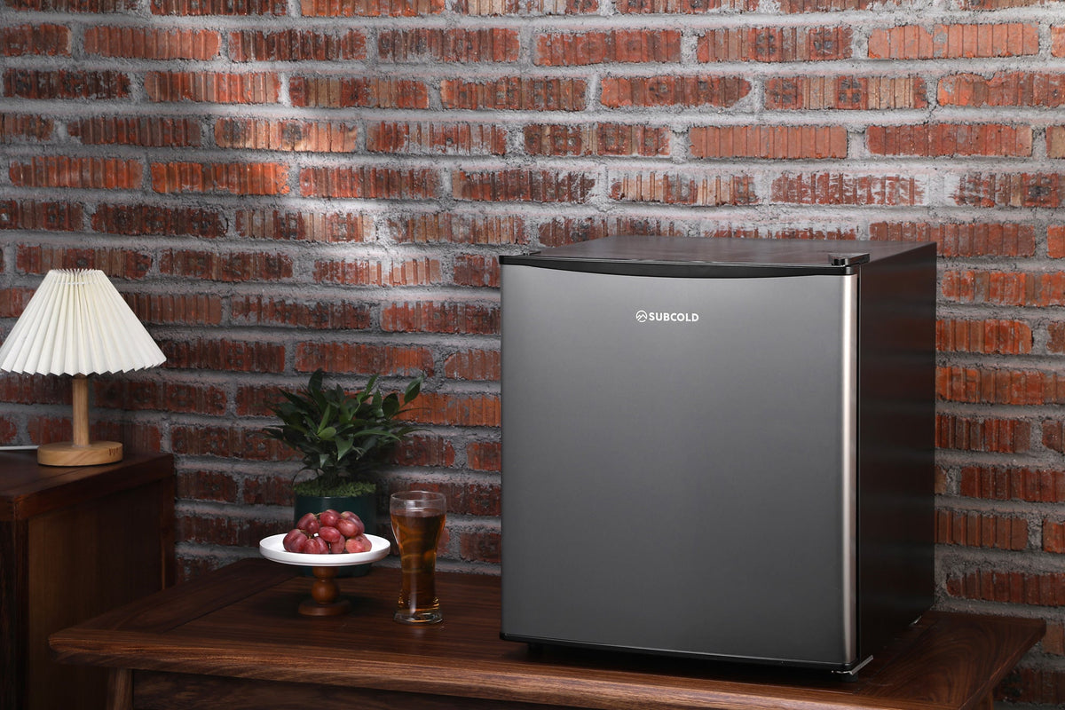 Stainless beer fridge on a tabletop with front logo