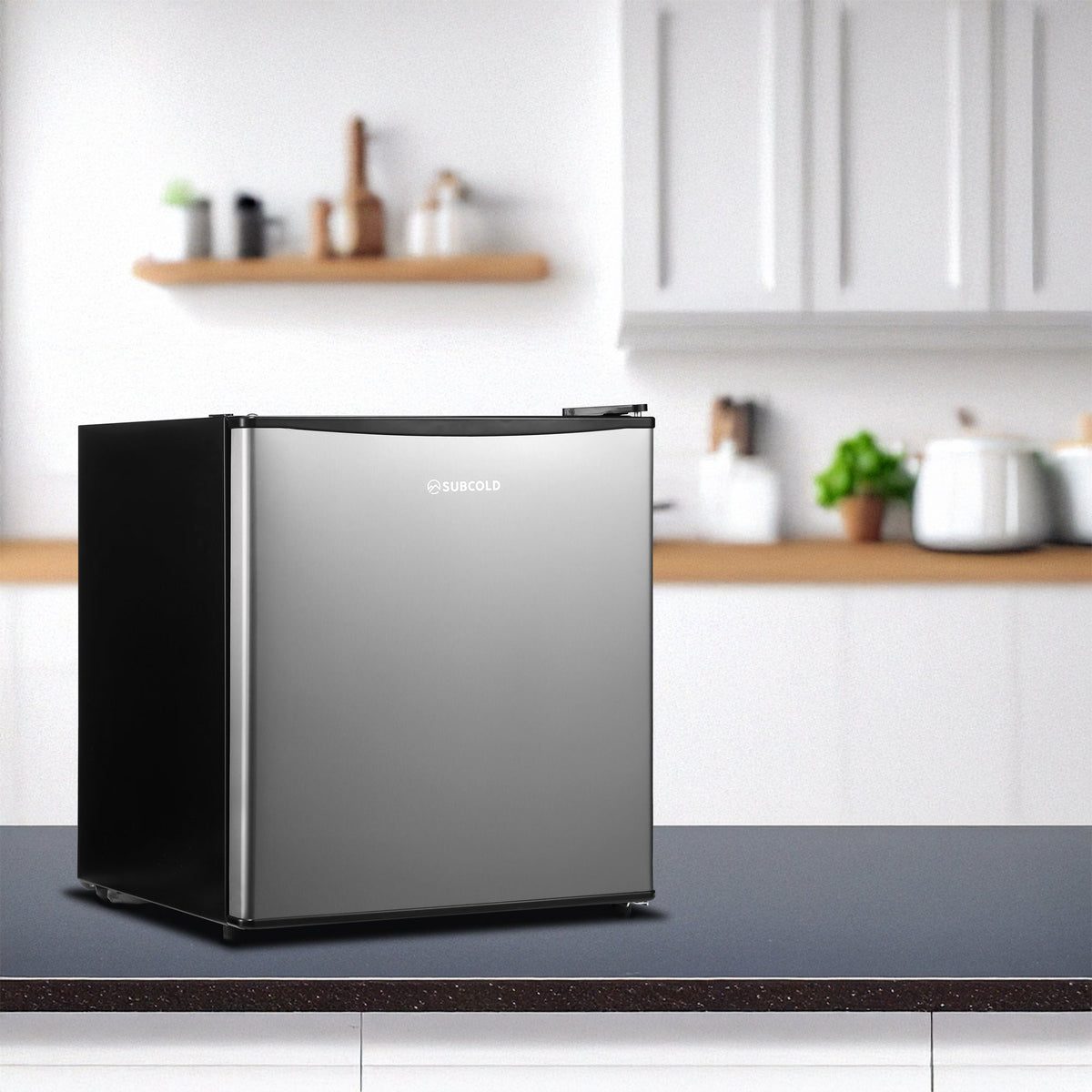 Stainless steel solid-door beer fridge with open door in kitchen setting
