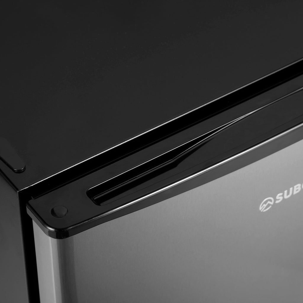 Black beer fridge door handle and stainless side panel detail