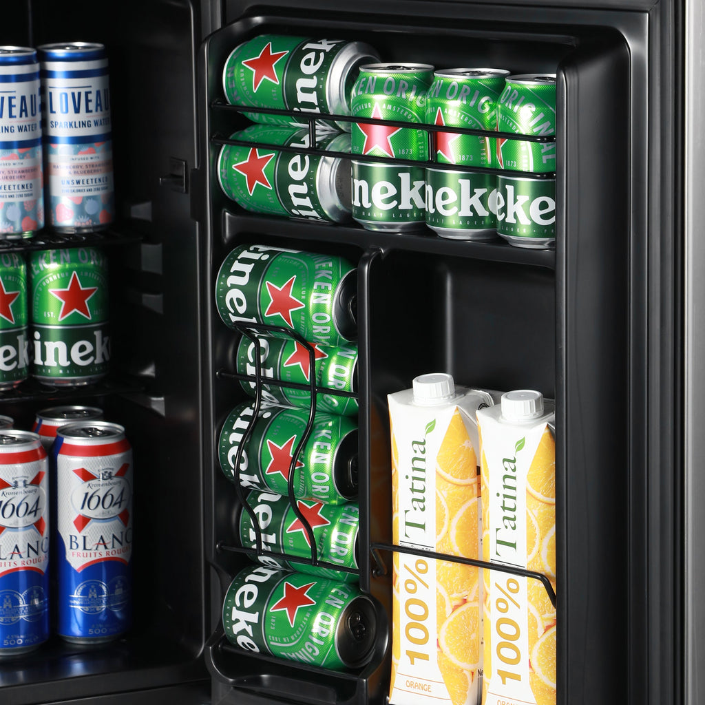 Beer fridge door-side view with packed bottles and bottled drinks