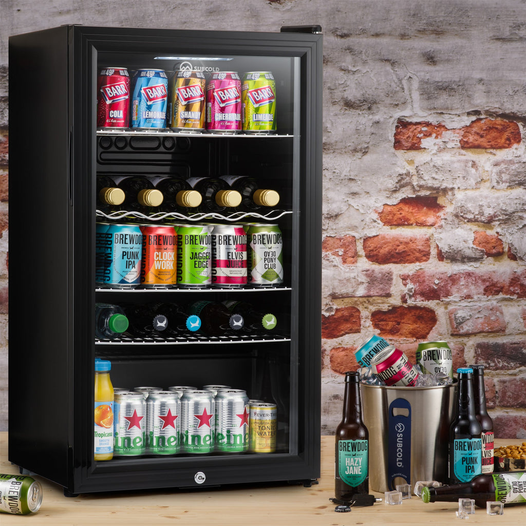 Black beer fridge with LED-lit shelves holding cans and bottles behind the glass door
