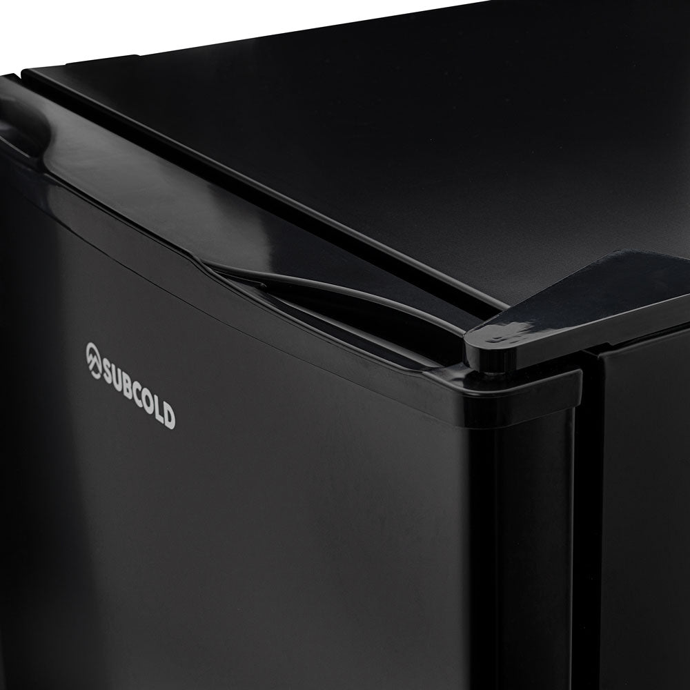 Black solid-door beer fridge with curved handle and SUBCOLD logo detail
