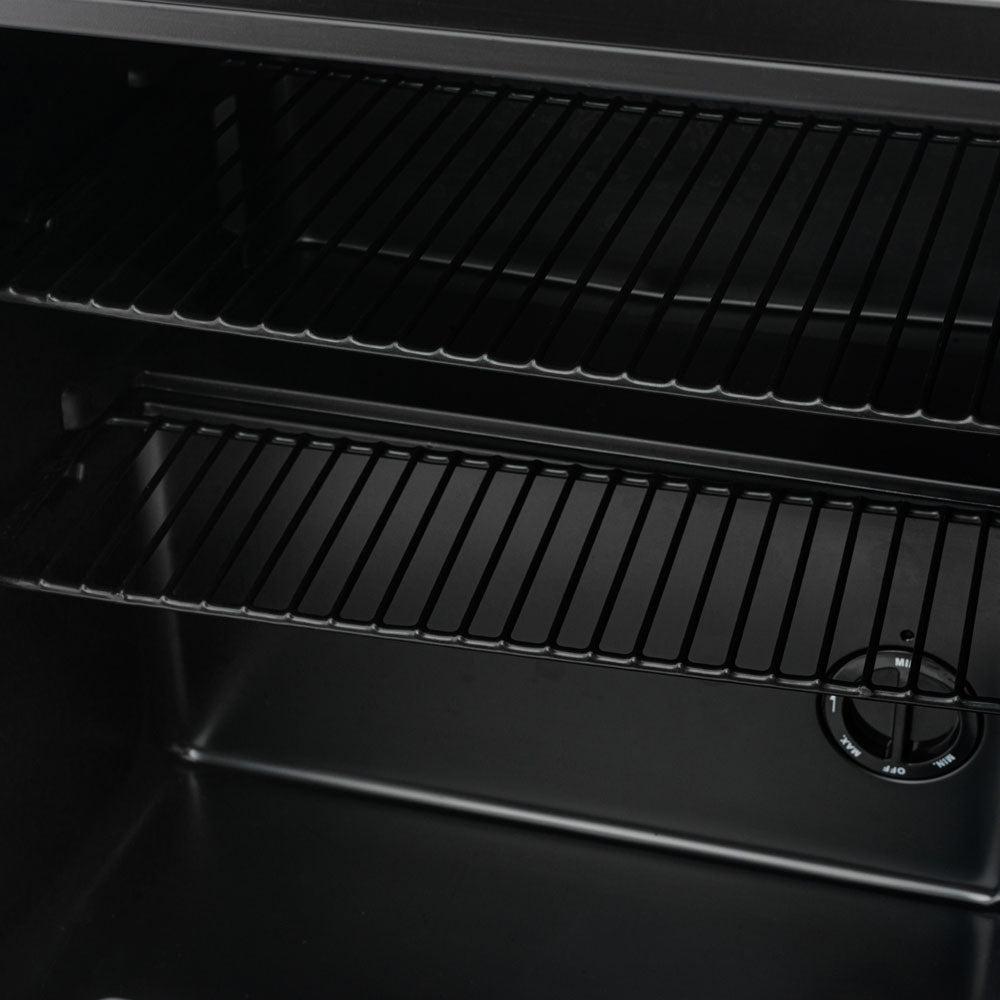 Black beer fridge interior with two metal wire shelves