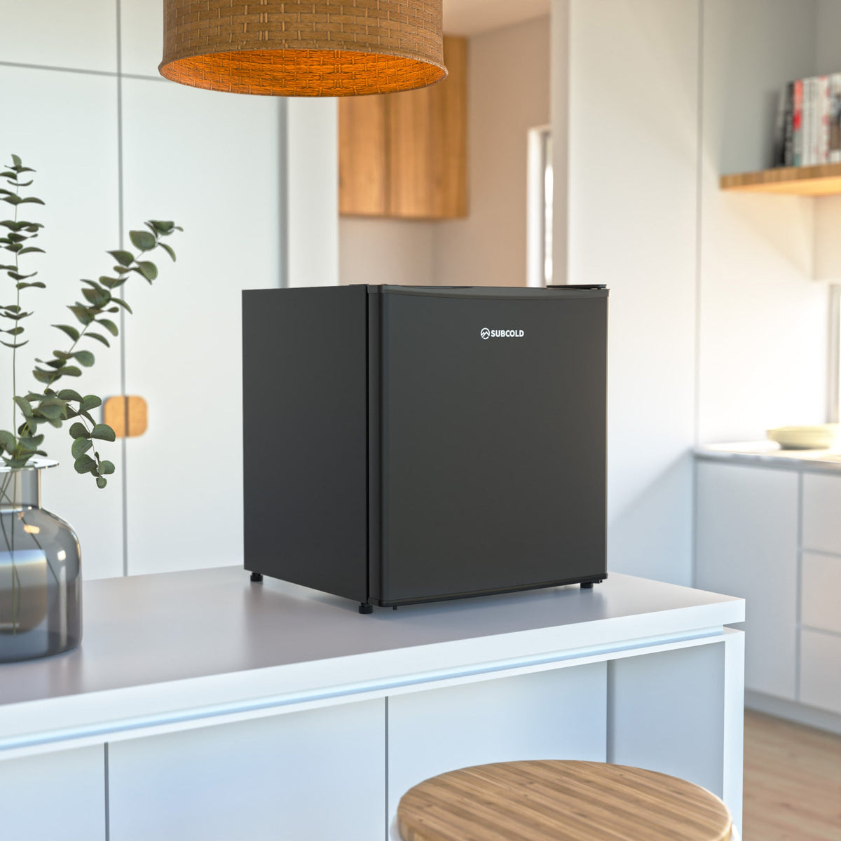 Black beer fridge on countertop in a kitchen setting