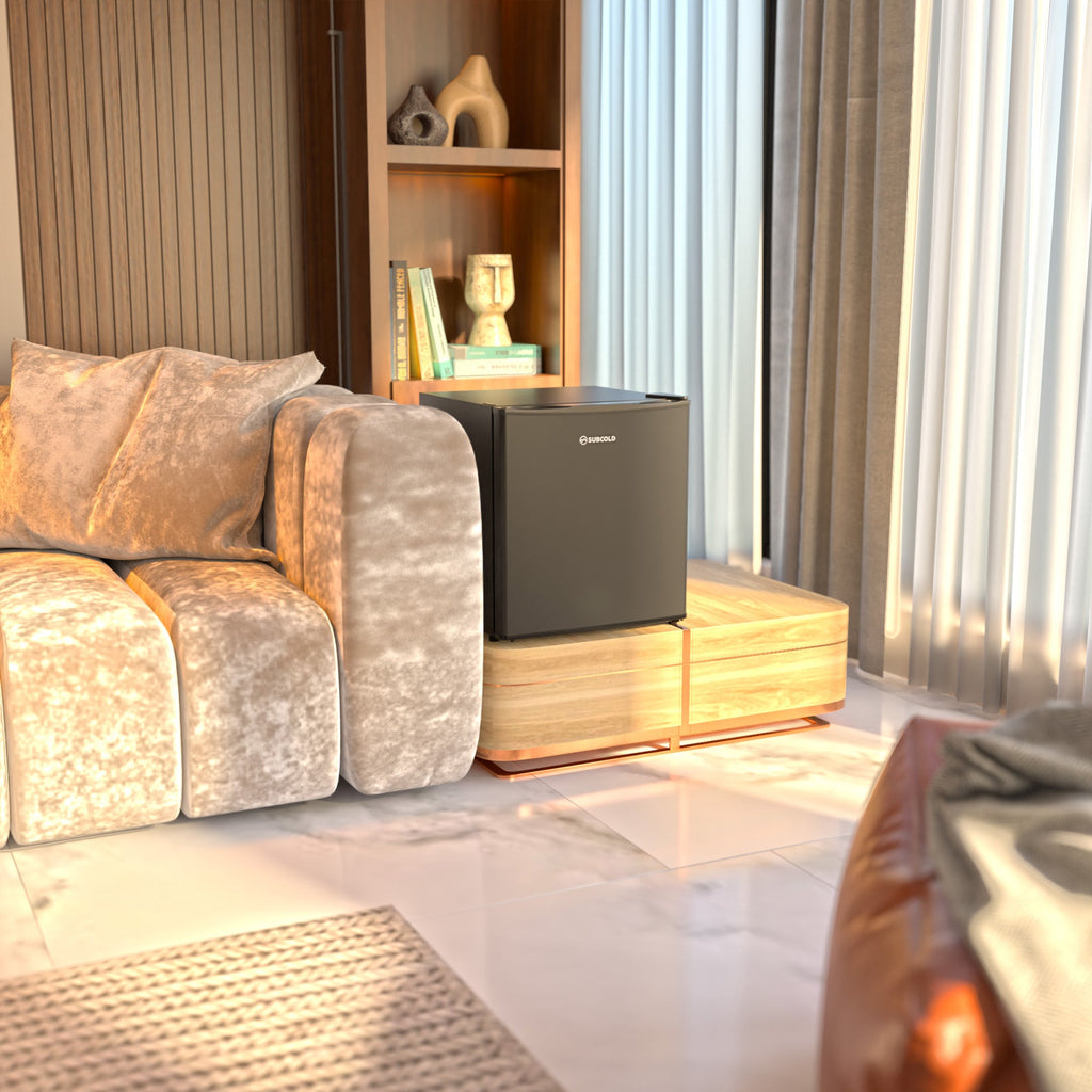 Black mini beer fridge on wooden shelf near living room seating