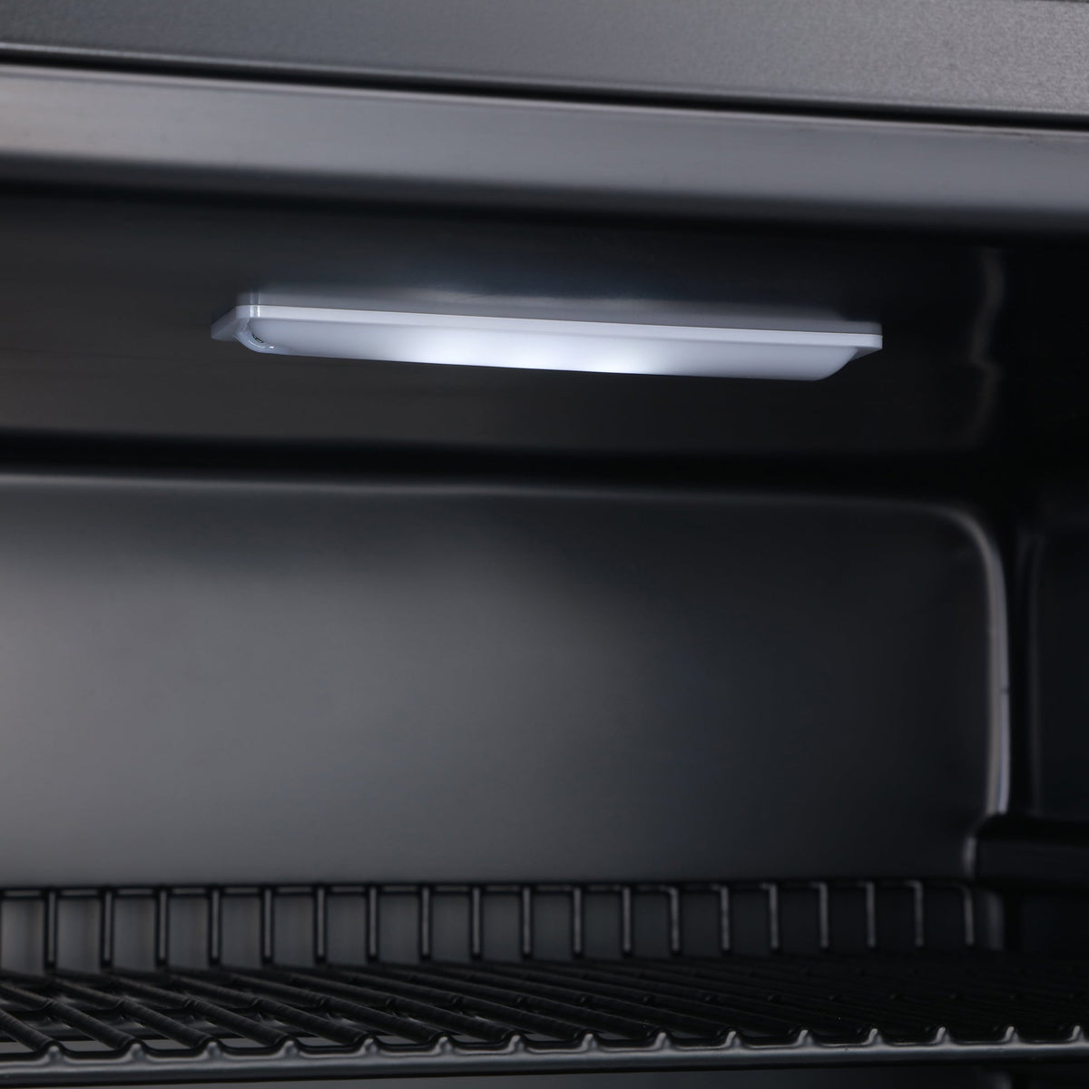 Black beer fridge interior LED light above wire rack
