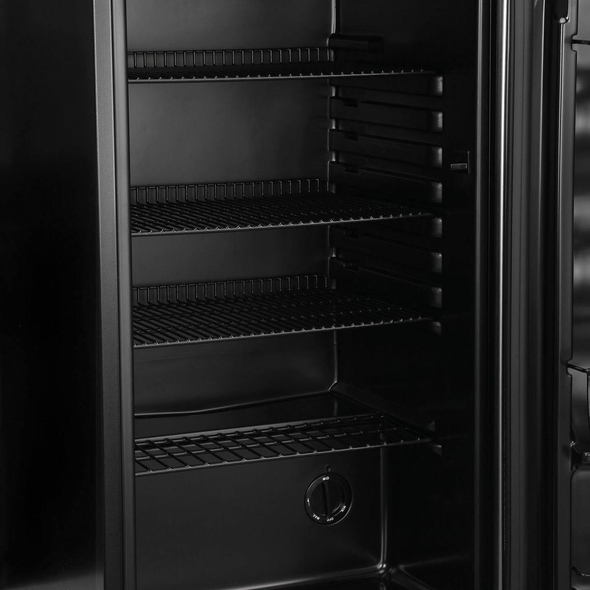 Black beer fridge interior with wire racks and bottom storage tray