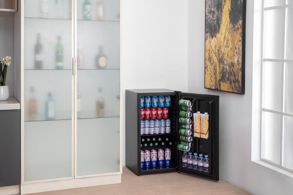 Black compact beer fridge with solid door and visible front badge