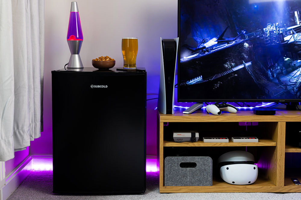 Black compact beer fridge standing upright with solid door