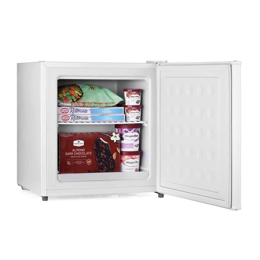White mini freezer with open door, showing packaged food items inside