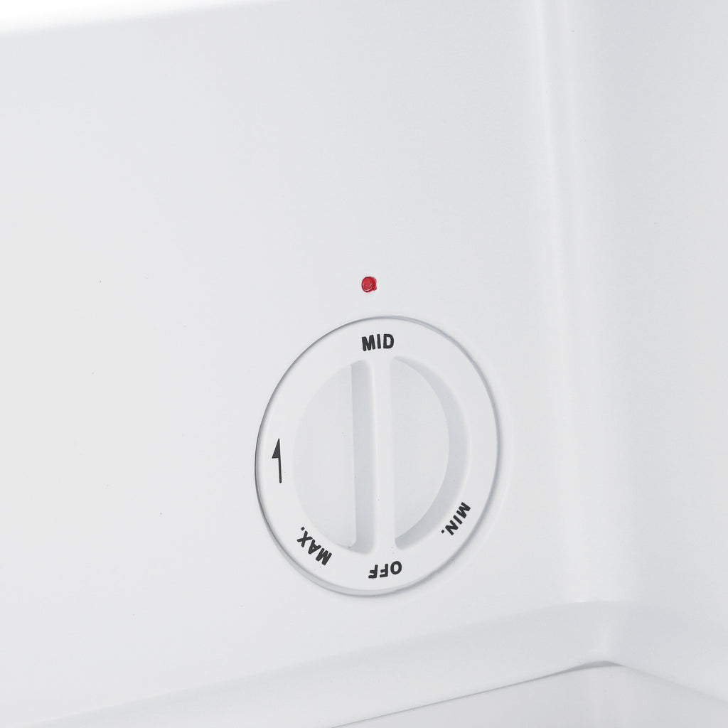 Mini freezer temperature dial showing MID on the white interior panel