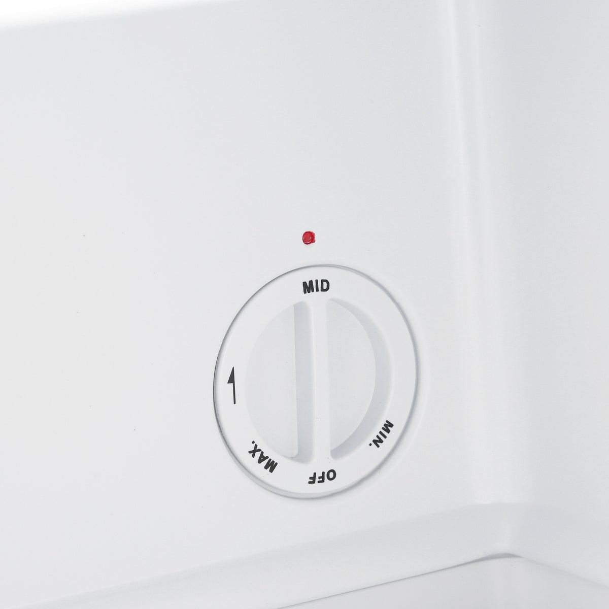Mini freezer temperature dial showing MID on the white interior panel