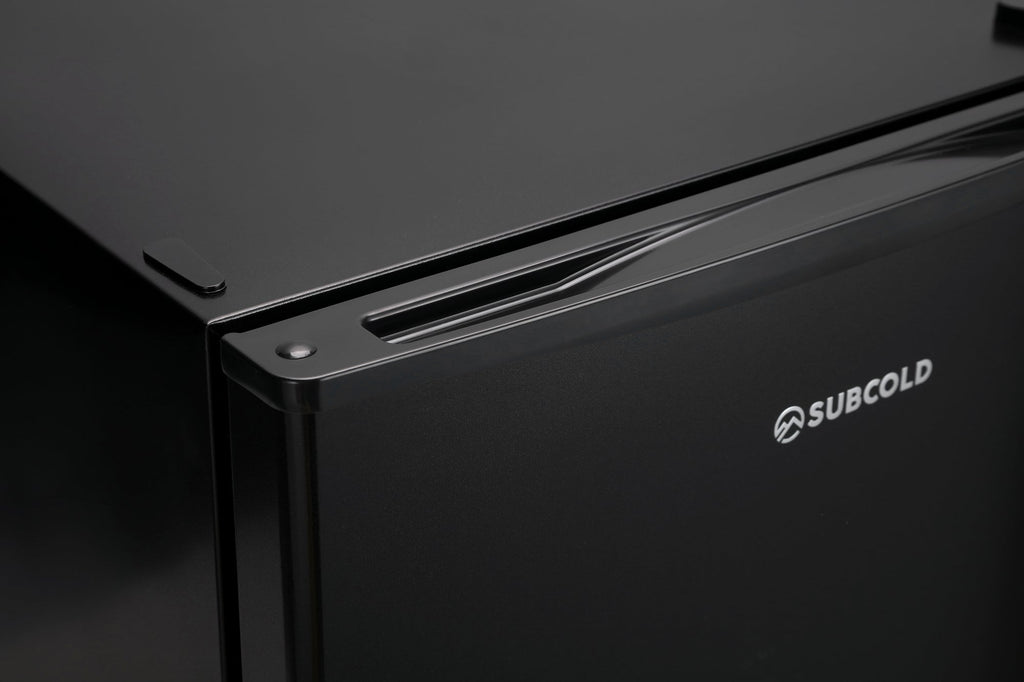 Black mini freezer side panel with Subcold logo and vented door handle