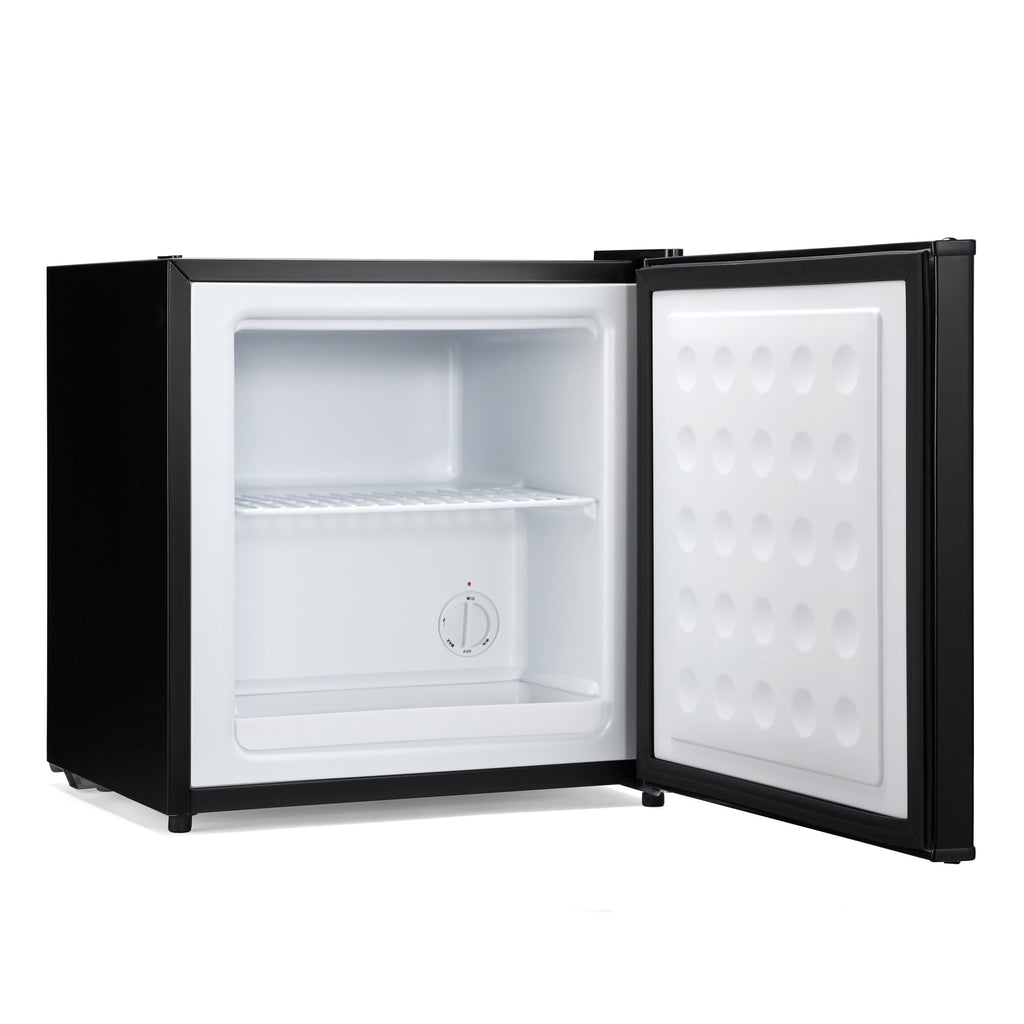 Black mini freezer with open door, empty white interior and temperature dial