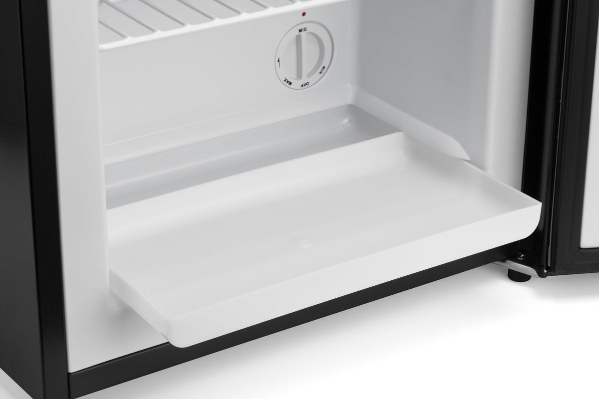 Mini freezer open door with flat shelf and white interior