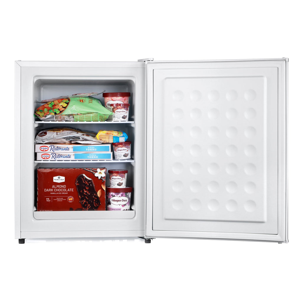 White mini freezer with open door, inner panel with embossed circular pattern