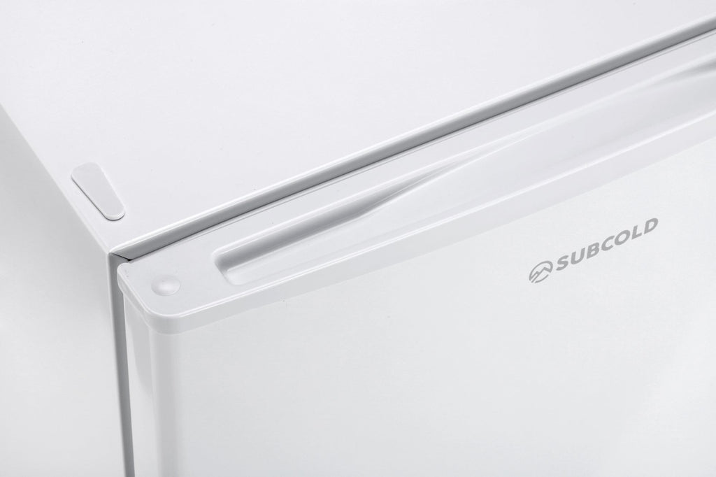 White mini freezer top edge with recessed handle and SUBCOLD logo