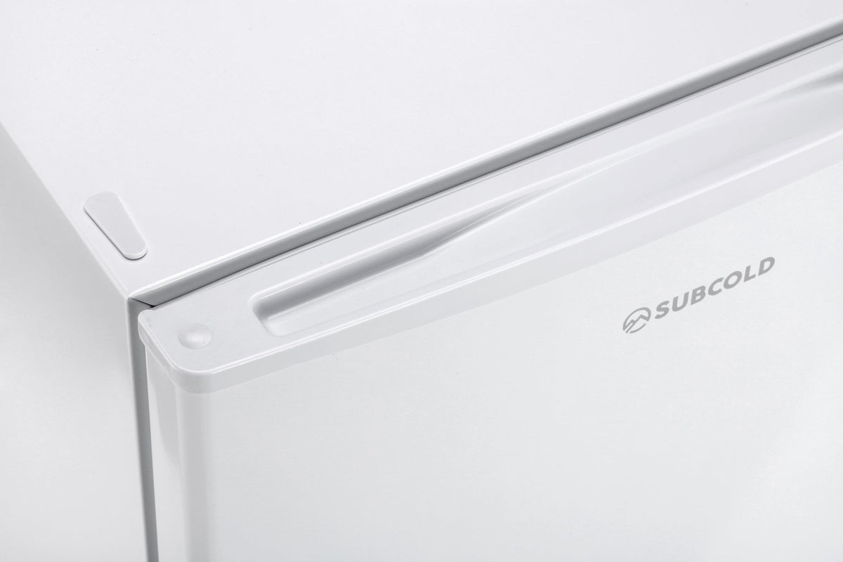 White mini freezer top edge with recessed handle and SUBCOLD logo