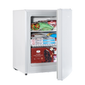 White countertop mini freezer with door open, showing stocked interior shelves