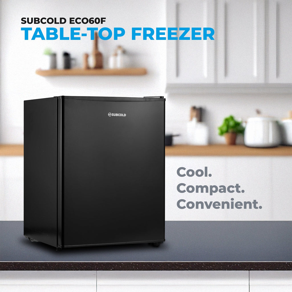 Black tabletop mini freezer with hinged door and compact rectangular body
