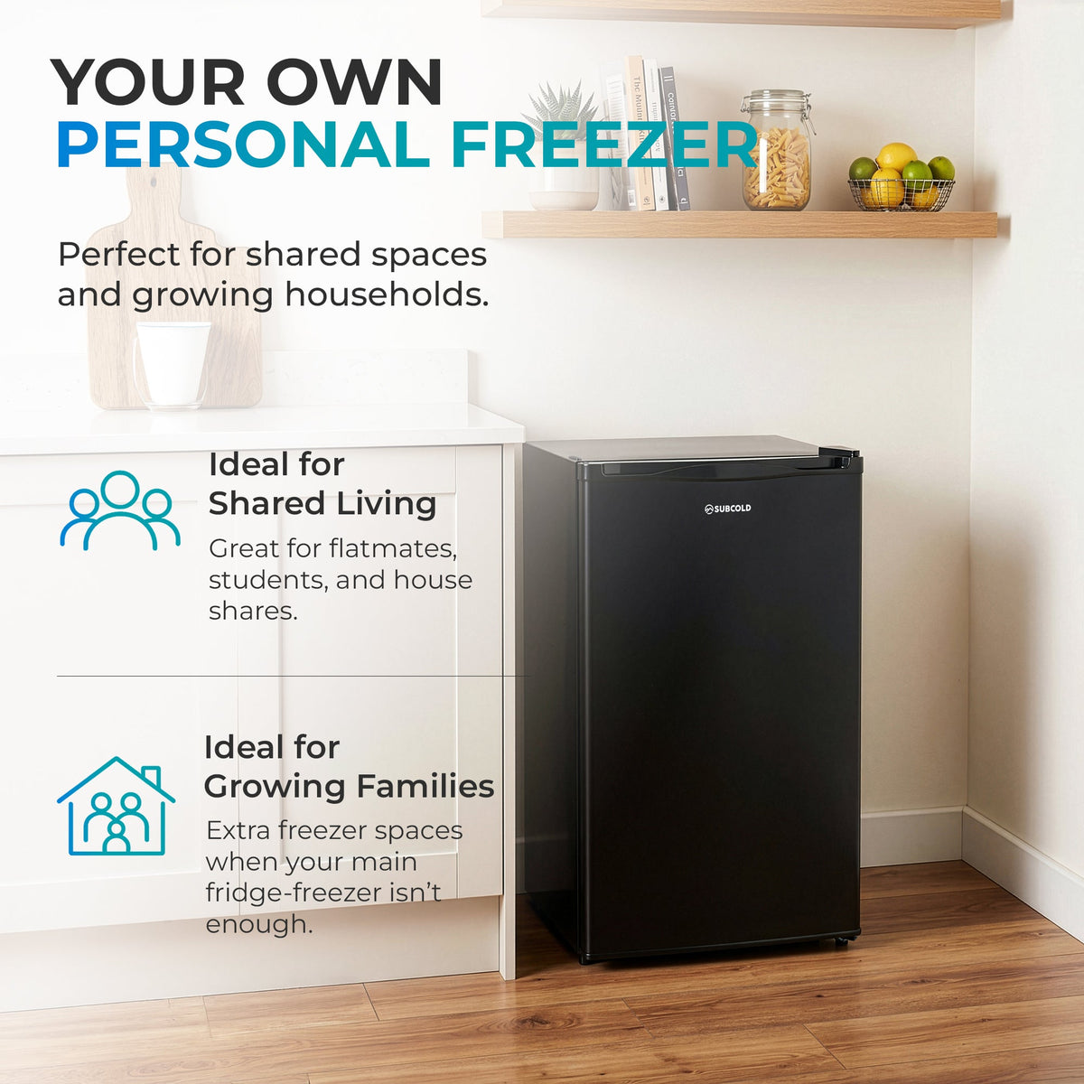 Black compact under-counter freezer in a small corner room with door closed