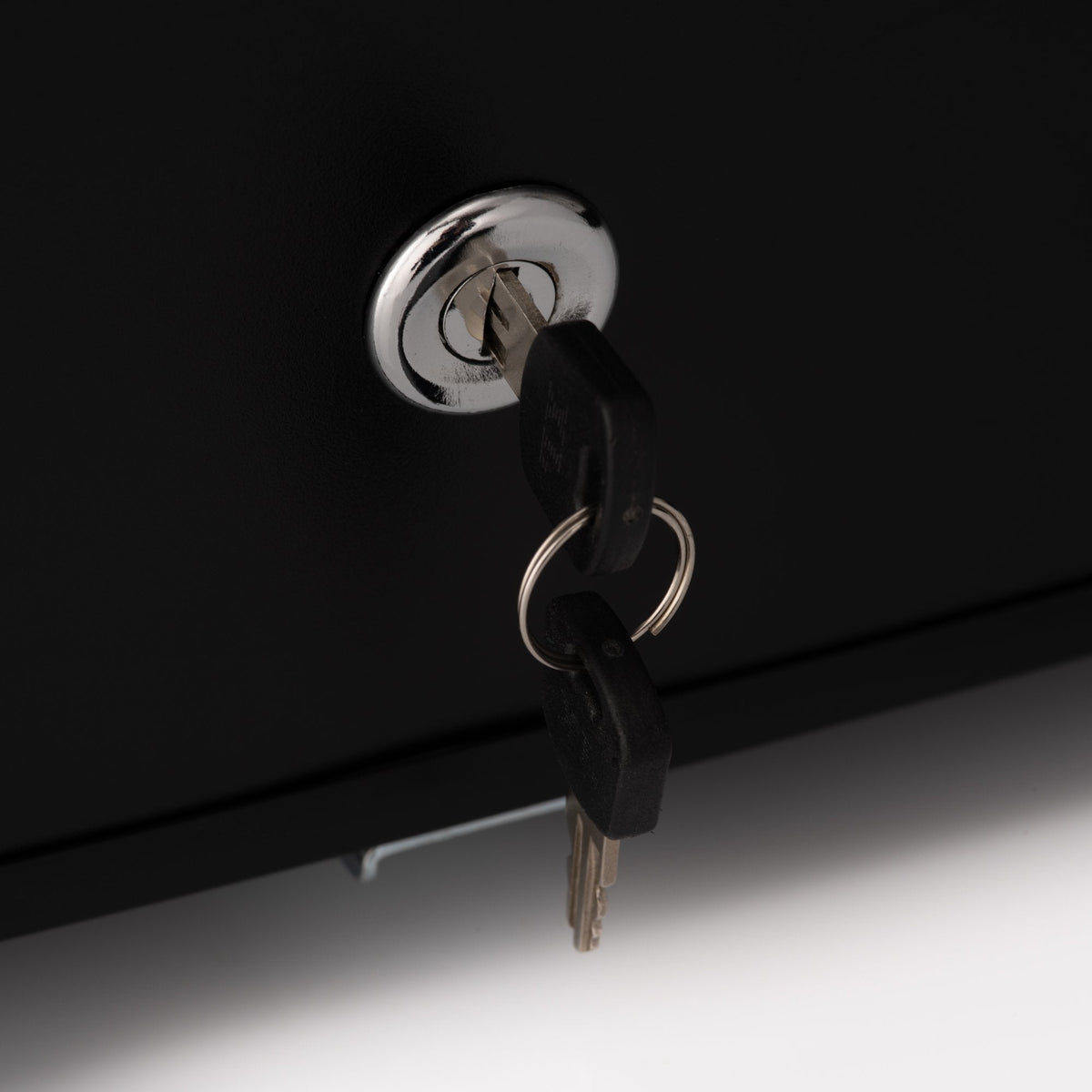 Under-counter LED fridge lock with metal key inserted in the front
