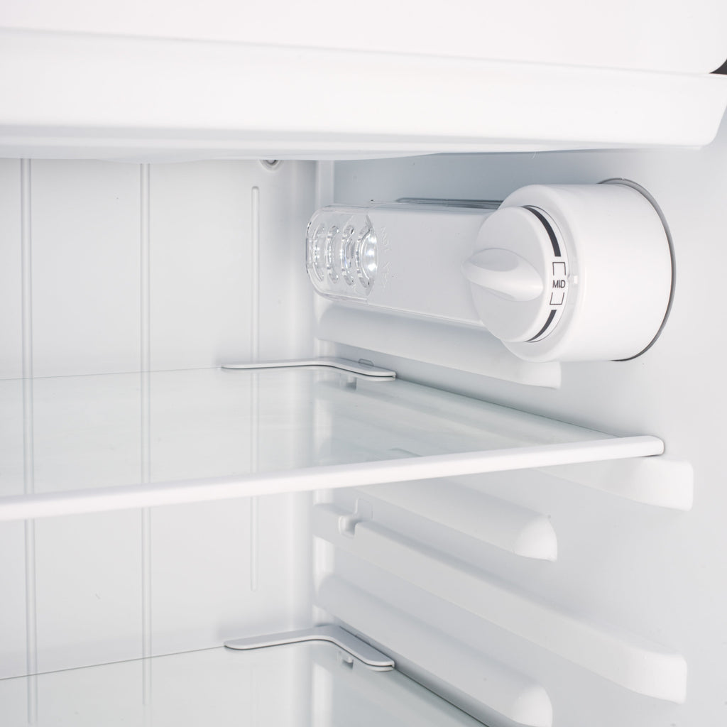 Under-counter fridge door interior rack with bottle holder and light