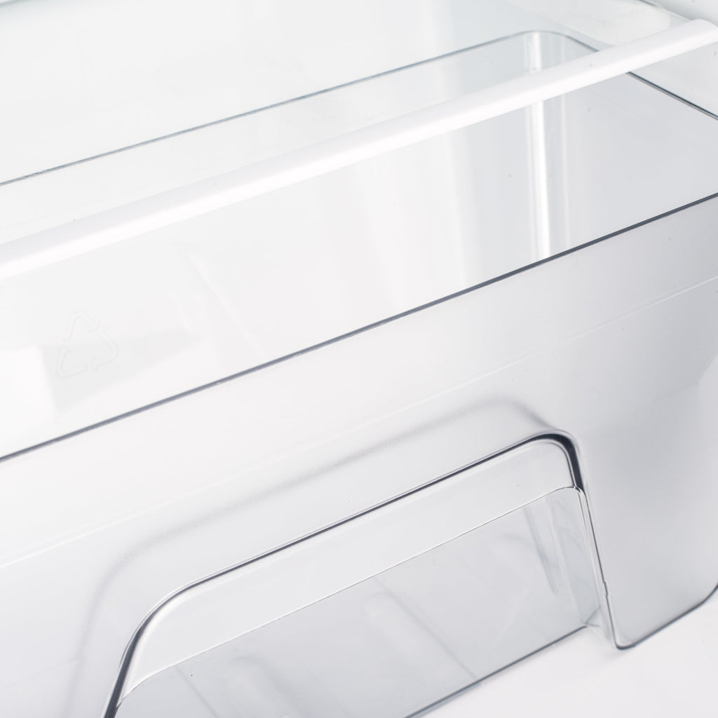 Under-counter fridge lower interior section with transparent drawer and metal edge