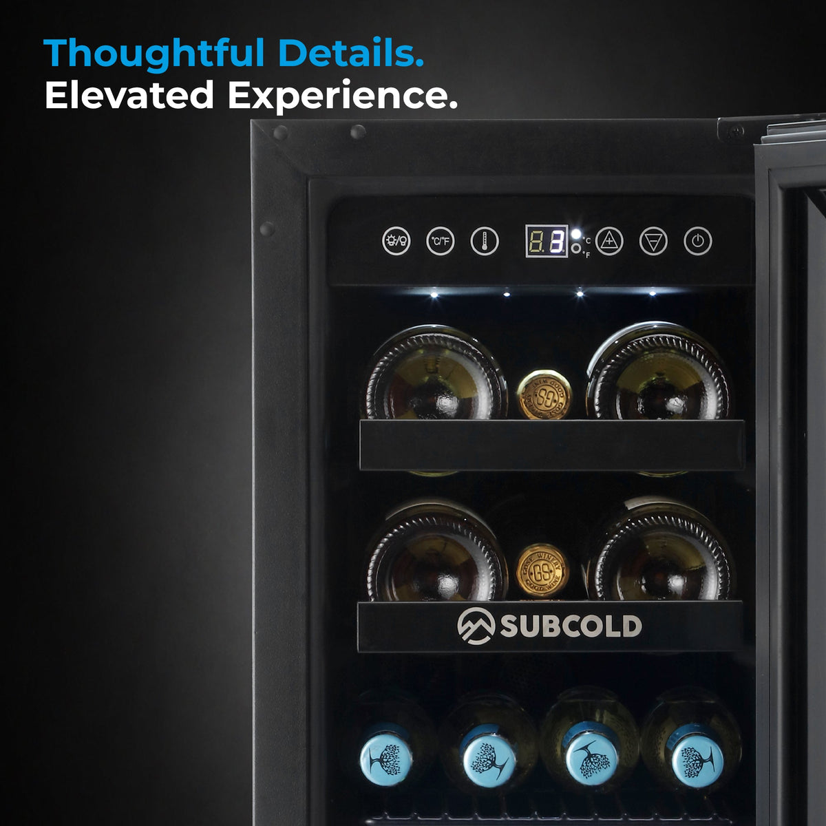 Black drinks and wine cooler interior close-up with SUBCOLD-branded shelf and bottles
