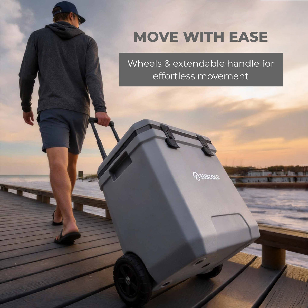 Subcold Master38 cool box with extendable handle and wheels, shown in transit