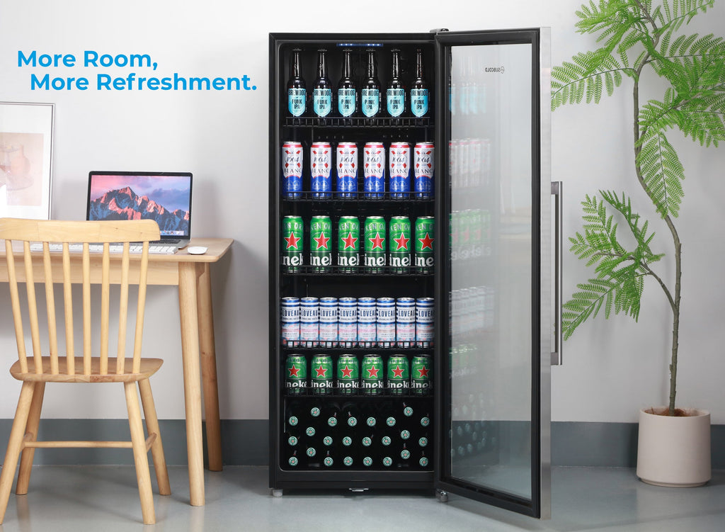Tall stainless drinks fridge with open glass door, shelves holding cans and bottles