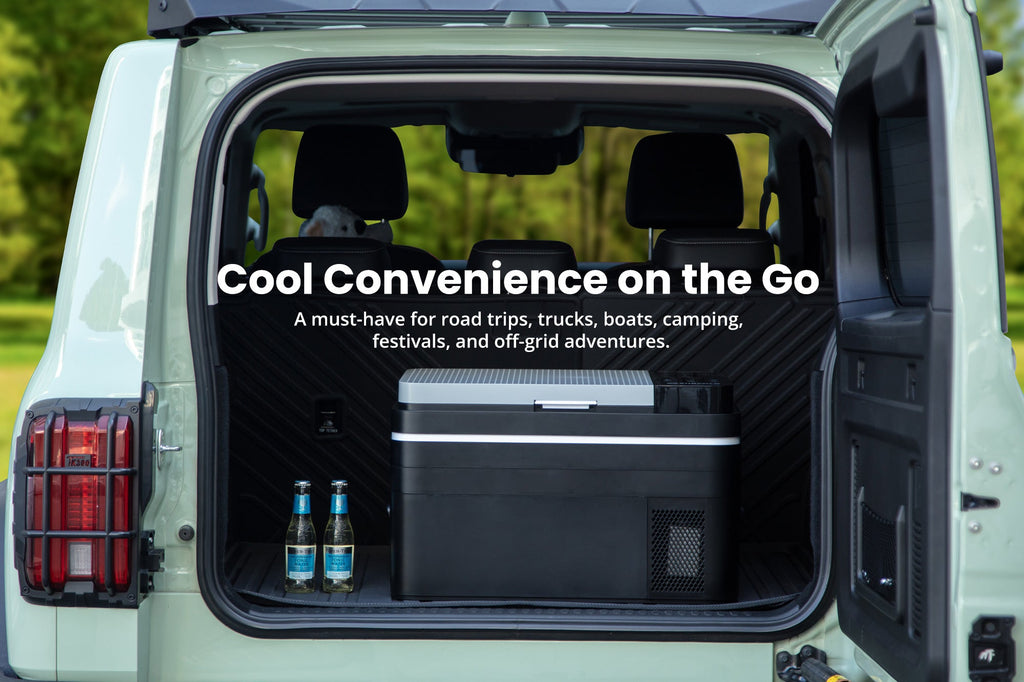 Portable car fridge in an open vehicle cargo area with the lid up.