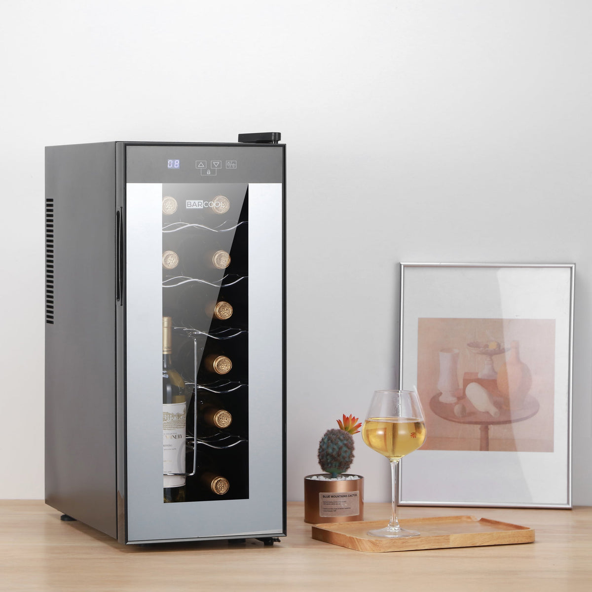 Black slim wine cooler with open glass door, showing bottles and LED interior