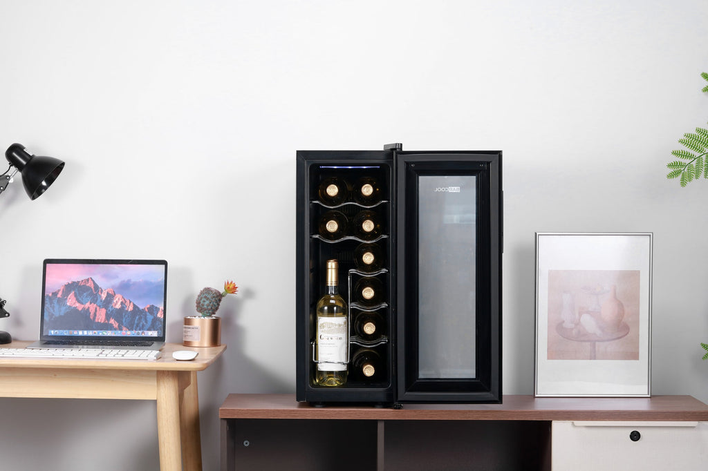 Compact black wine cooler with open glass door, bottle shelf and display racks