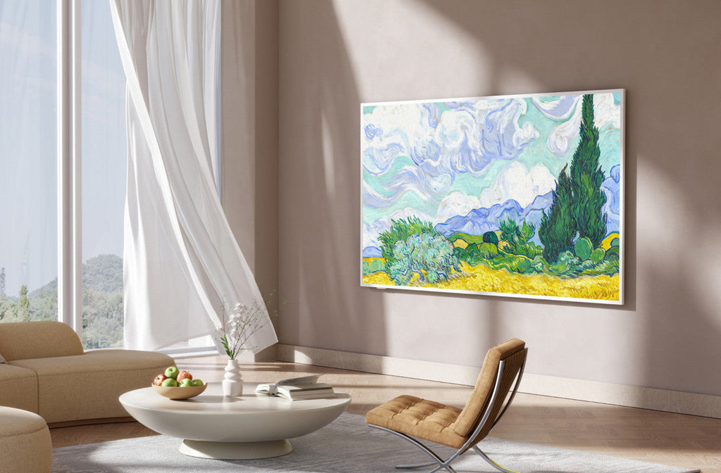65-inch QLED 4K smart TV mounted on a wall in a living room