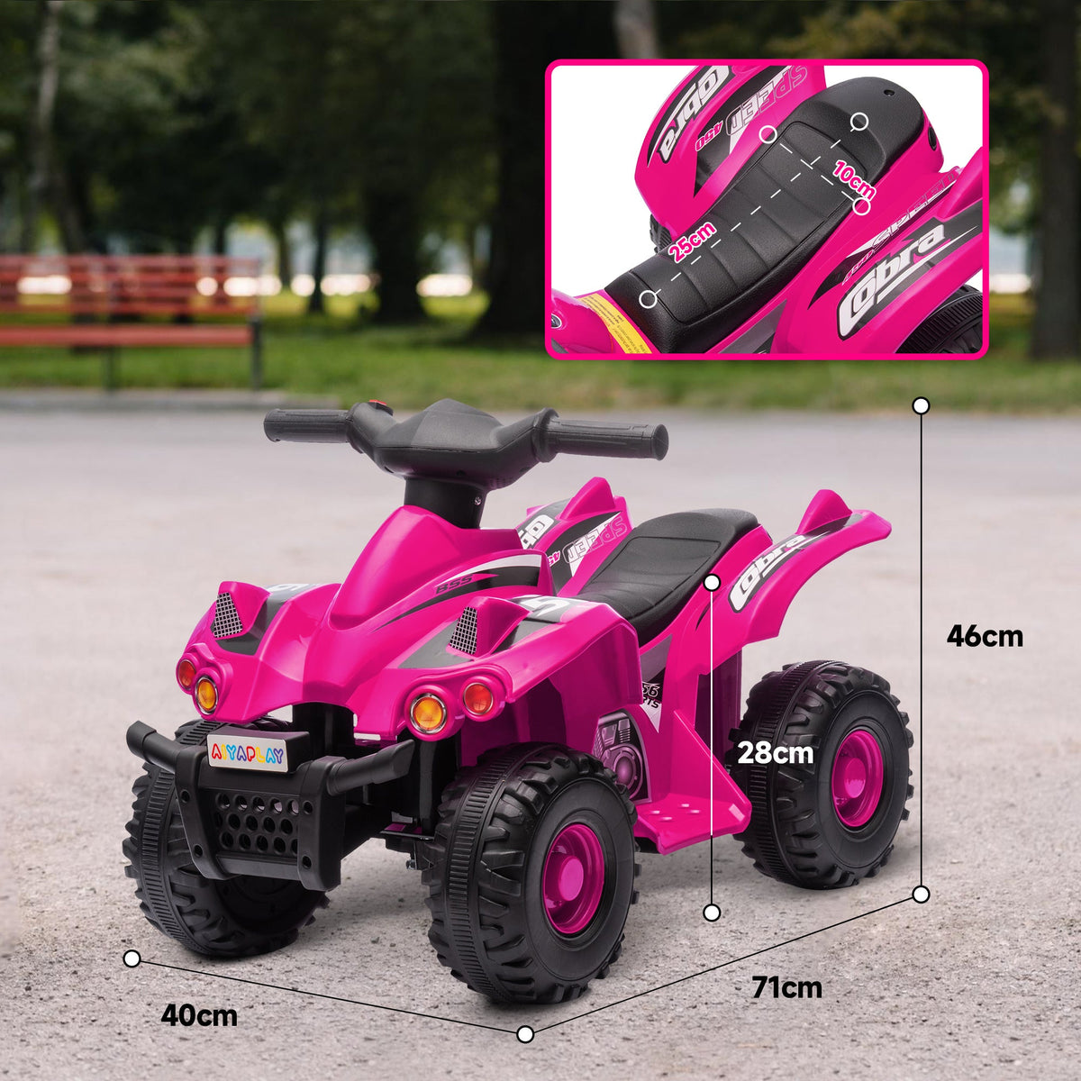 Pink kids electric quad bike at low angle, showing seat, handlebars, and wheels