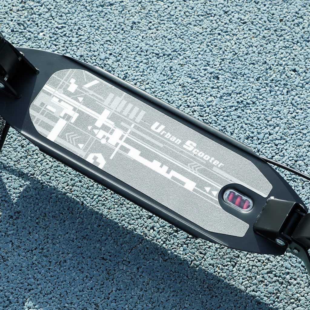 Black scooter deck with patterned grip surface and red brake light detail