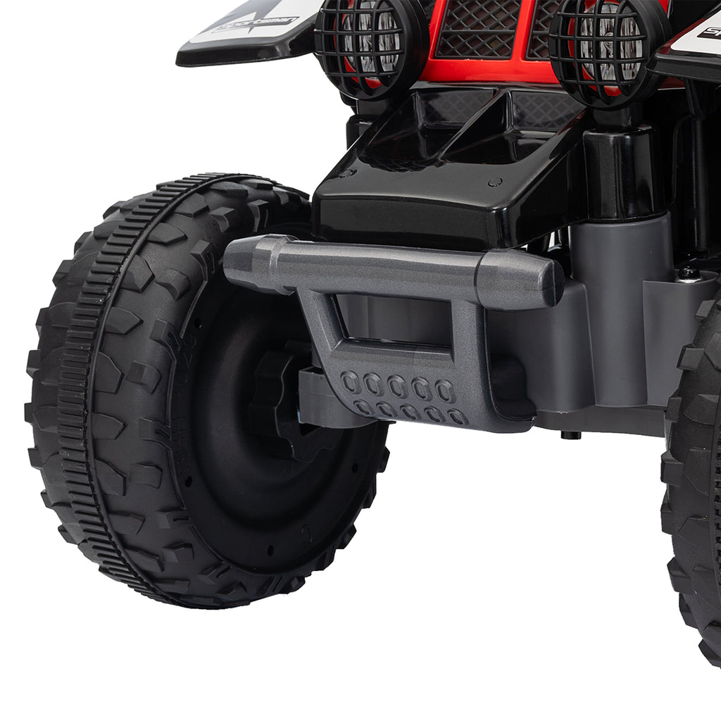 Front wheel and suspension of a black kids electric quad bike with treaded tire