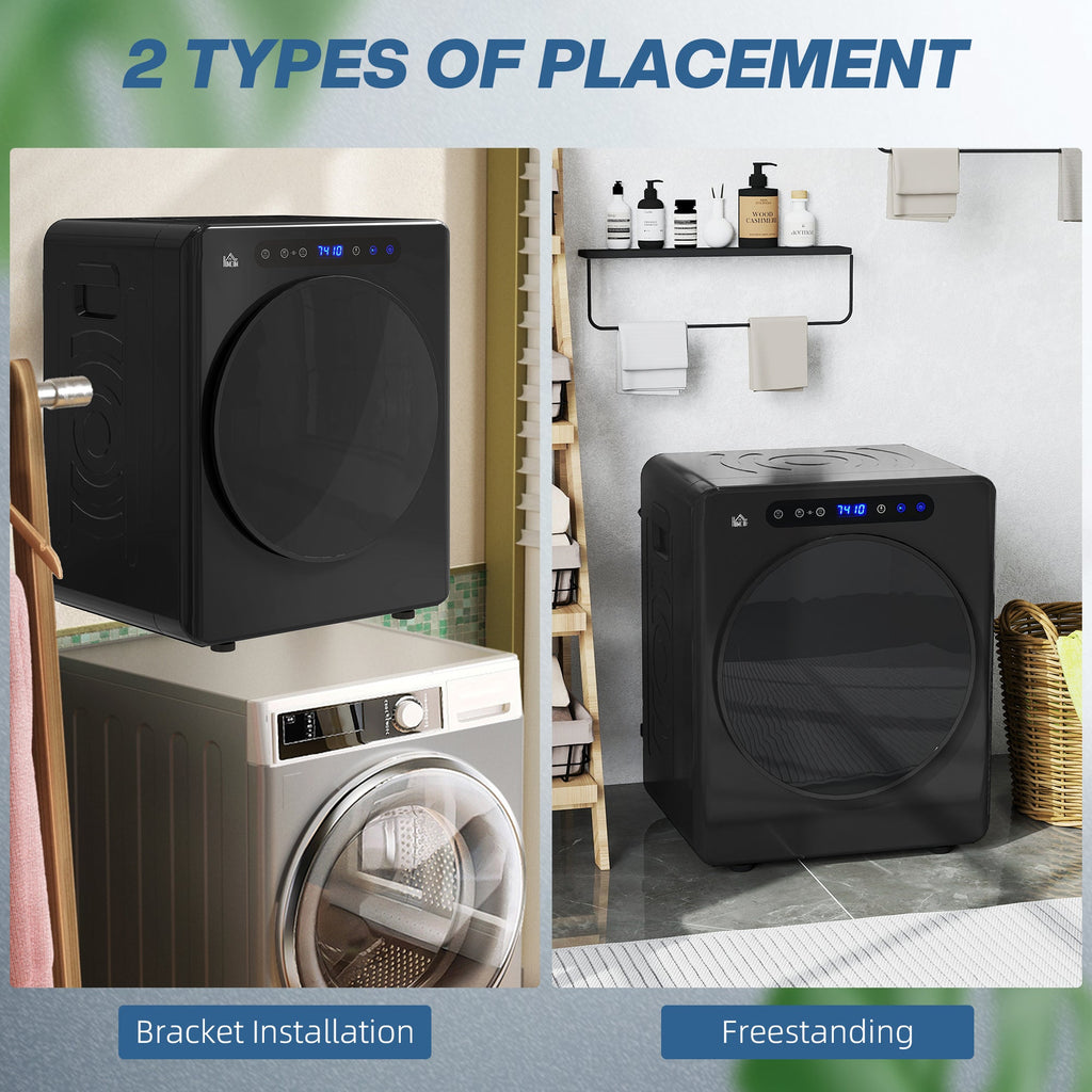 Black compact tumble dryer on the floor with front glass door and controls