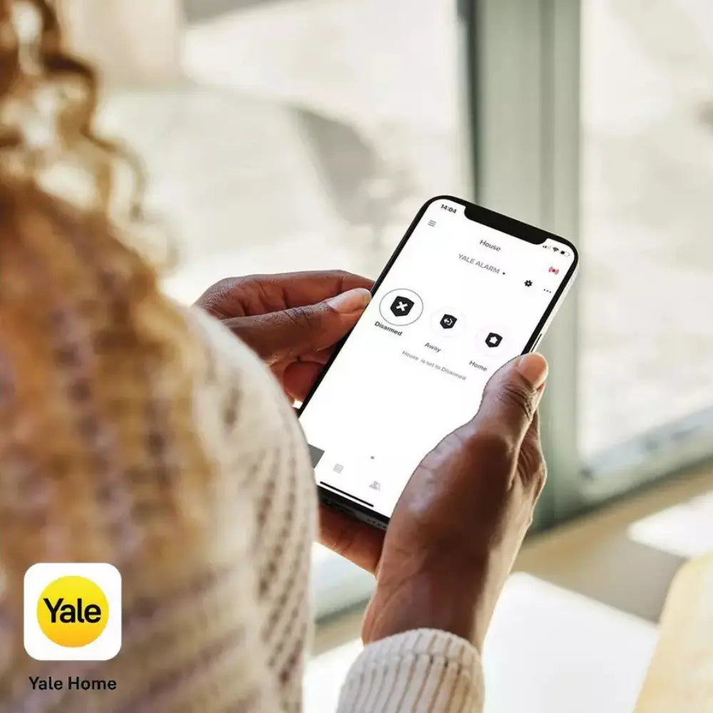 Yale Home app on smartphone controlling outdoor siren