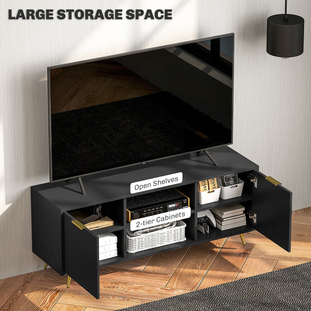 Black TV stand with open top and open shelves, ribbed cabinet base, gold legs