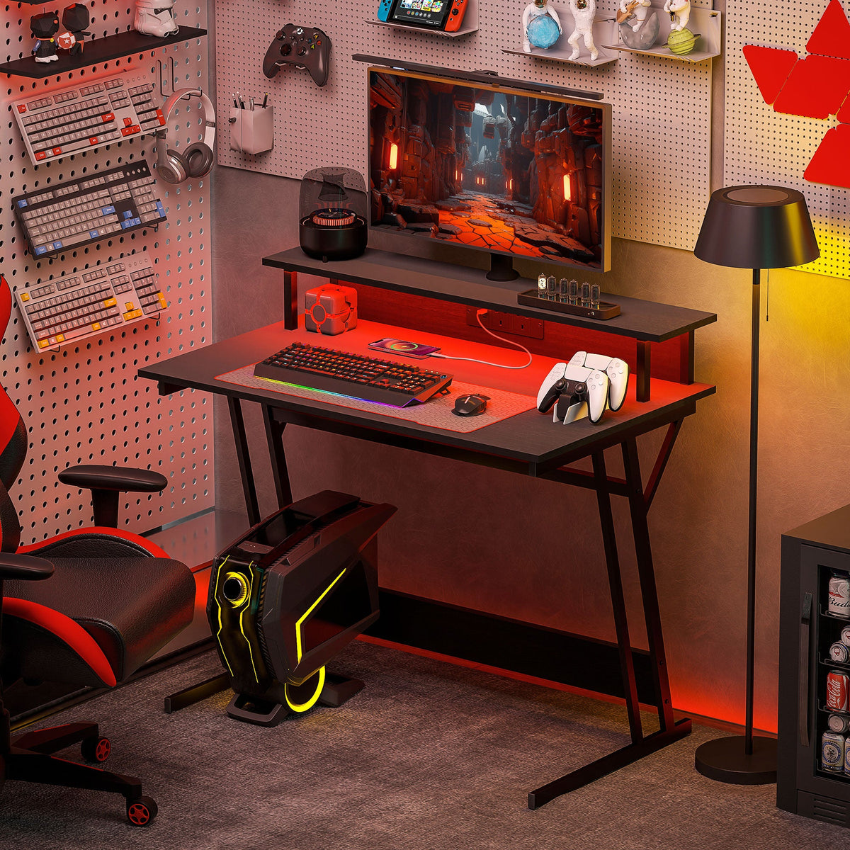 Black gaming desk with RGB LED lighting, keyboard tray, and open under-shelf