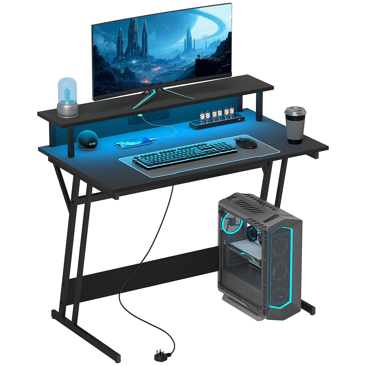 Black Z-shaped gaming desk with monitor stand and built-in LED light strip