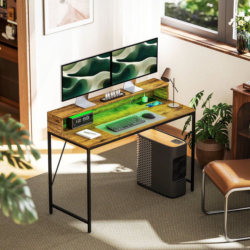 Rustic brown gaming desk with LED lighting, dual monitors, keyboard tray, PC